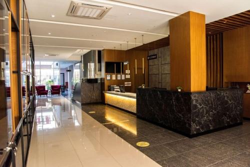 a lobby of a building with a reception desk at Ajsel Hotel in Durrës