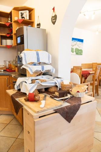 a kitchen with a counter with some food on it at Hotel Valerie in Saalbach Hinterglemm