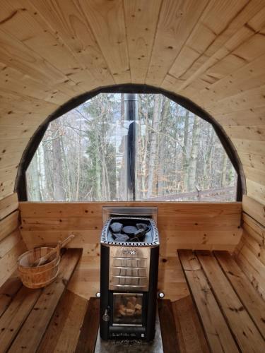 an inside view of a log cabin with a window at Apartament Buczyna in Brenna