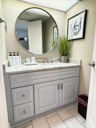 a bathroom with a sink and a mirror at 453 Shore Fun Oceanfront Great Location in Myrtle Beach