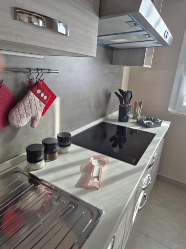 a kitchen with a stove and a counter top at Attico Solaris in Reggio Calabria