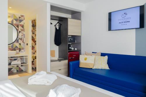 Posteľ alebo postele v izbe v ubytovaní Tuscany Hotel Alle Dune