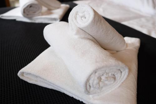 two rolls of white towels on a table at Exklusives Studio 1 in Steinfeld in Steinfeld