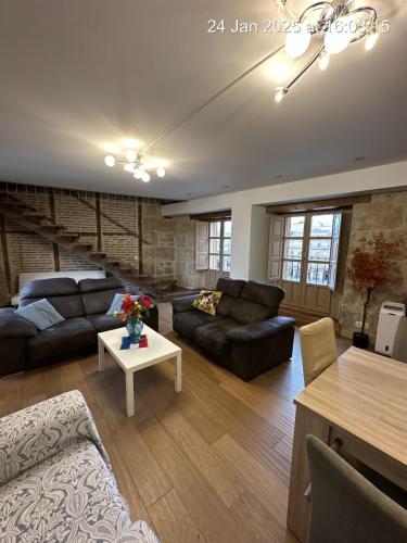a living room with a couch and a table at Principal Plaza in Salamanca