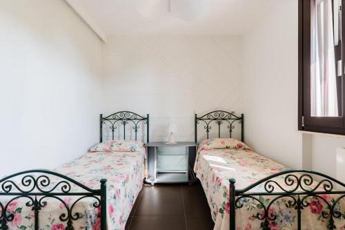 Katil atau katil-katil dalam bilik di Intera villa ad uso esclusivo con 2 bagni 4 camere da letto,garage,giardino,area fitness,lavatrice,wifi