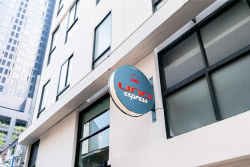 a sign on the side of a building at UNO Express Asoke Sukhumvit Bangkok in Bangkok