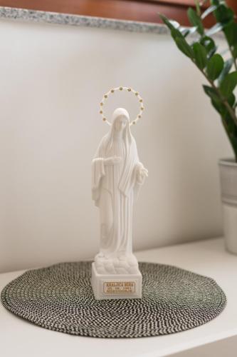 a statue of the christ redeemer sitting on a table at Apartman Krtalić in Međugorje