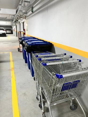 a row of shopping carts in a parking lot at Sea Garden Towers PDE in Punta del Este