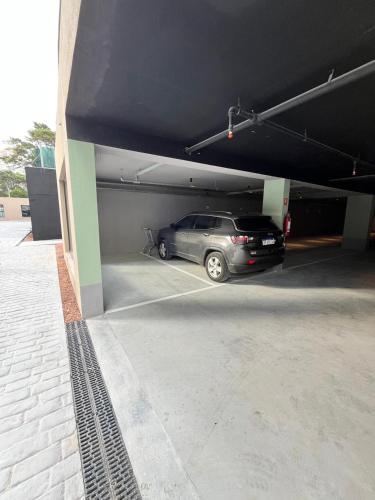 a car is parked in a parking garage at Sea Garden Towers PDE in Punta del Este