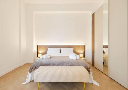 a bedroom with a large bed and a mirror at Residenza Camillo - Palermo Centro in Palermo