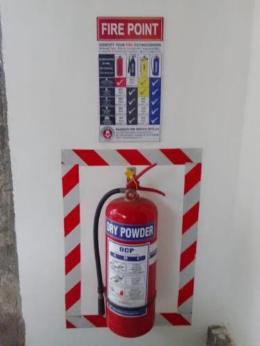 a fire hydrant in a box with a fire extinguisher at Wilpattu Buma Lodge in Pahala Maragahawewa