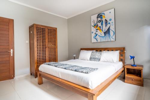 Ένα ή περισσότερα κρεβάτια σε δωμάτιο στο Melati Villa by iBali Management