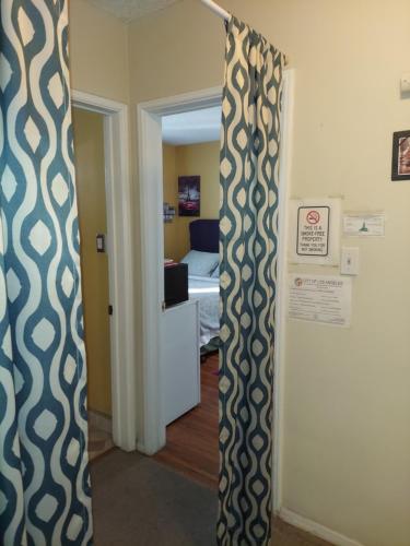 a room with a door open to a bedroom at Burbank Airport Universal City in Hollywood Burbank Airport