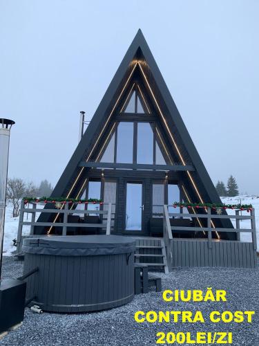 a house being constructed with a gambrel roof at Chalet Charme Bucovina in Coşna