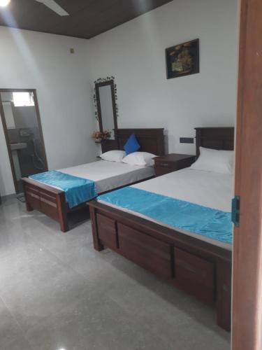 Postel nebo postele na pokoji v ubytování Mandara Holiday Home