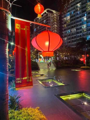 a lit up city at night with red lights at Holiday Escape Philippines in Manila