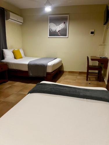 Cama o camas de una habitación en Hotel Yamilí