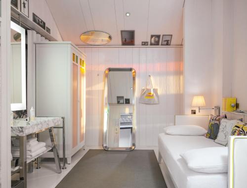 Ένα ή περισσότερα κρεβάτια σε δωμάτιο στο Hotel La Co(o)rniche