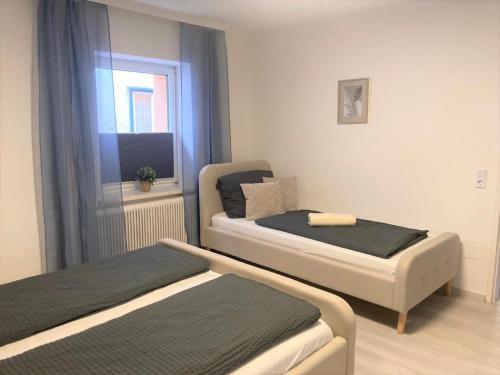 Postel nebo postele na pokoji v ubytování Ferienwohnung im Zentrum mit Parkplatz