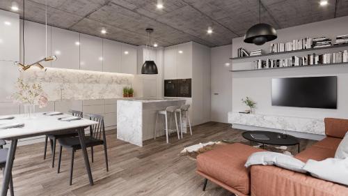 Una cocina y una sala de estar con una mesa y un sofá. en New Prague Apartment - Varta Alpha, en Praga