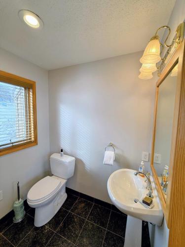 a bathroom with a white toilet and a sink at CR16 Ski-in/Out luxury home mountain views Bretton Woods in Bretton Woods