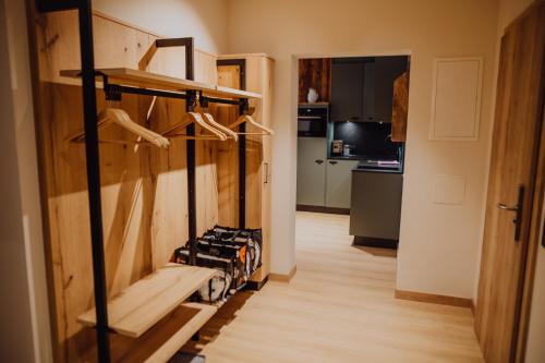 a hallway with a room with a kitchen and a room with a room at Alpenhotel Perner in Obertauern