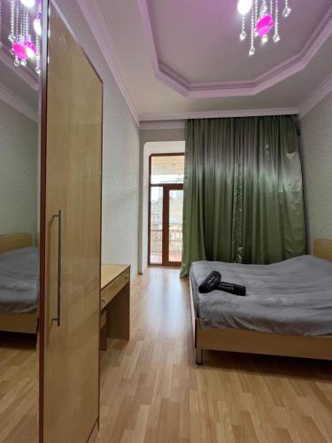 Llit o llits en una habitació de Apartment UH