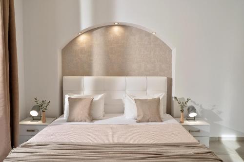 a white bedroom with a large white bed with pillows at Alekos Apartments 2 Netflix, Self Check-In in Athens