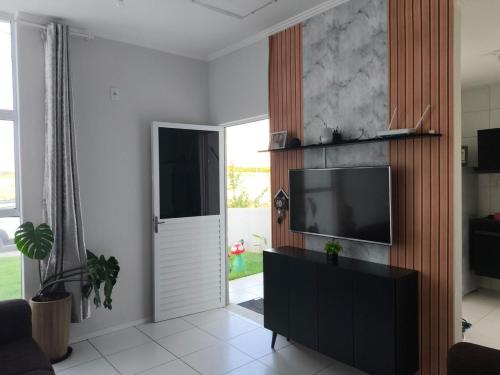 Et tv og/eller underholdning på Paraíso em Aquiraz - Paz, Sol e Mar ao seu Alcance