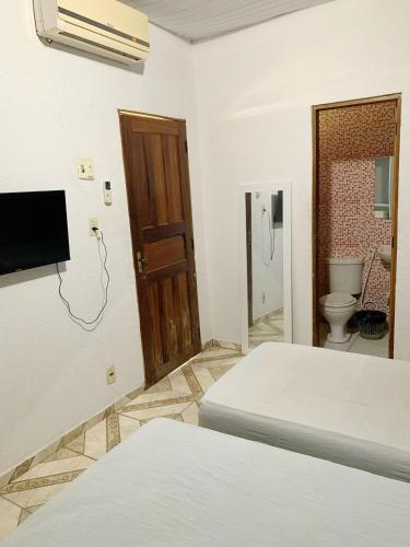 Cama o camas de una habitación en Pousada Estilo Brasil
