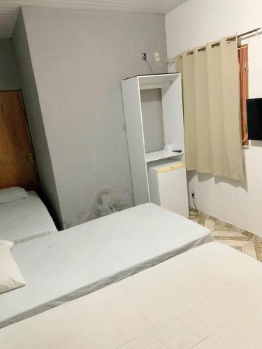 Cama o camas de una habitación en Pousada Estilo Brasil