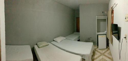 Cama o camas de una habitación en Pousada Estilo Brasil