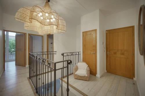a large room with a chandelier and a stair case at FRGK "VILLA La Cote D'Azur" in Cannes