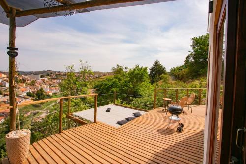 a balcony with a view of a city at Refúgio das Serras in Cunha