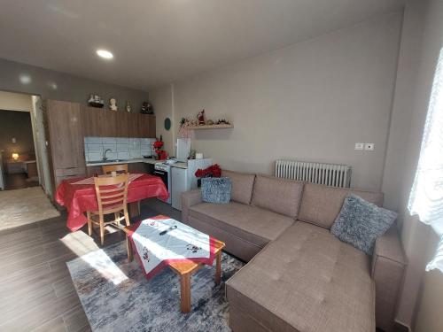 a living room with a couch and a table at River Studio in Vasilikí