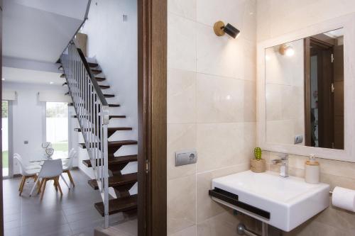 a bathroom with a sink and a staircase at Fantástica Casa Adosada con Piscina y Parking in Mojácar