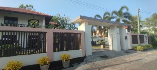 a house with a gate in front of it at Sella Villa in Seeduwa