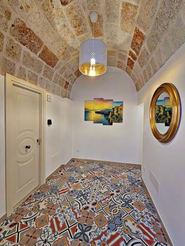 a room with a tile floor and a ceiling at RomAntica - Sunset & Terrace in Polignano a Mare