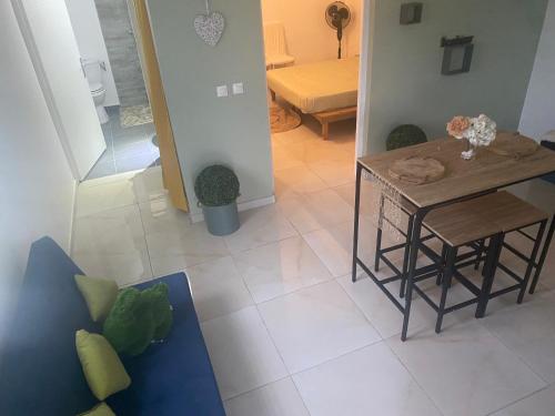 a kitchen and dining room with a table and chairs at Rivé an Key La in Case-Pilote
