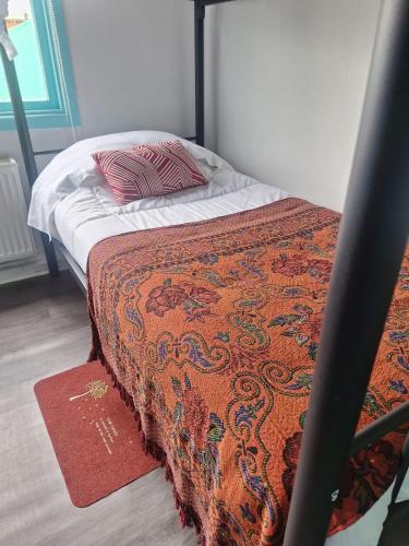 Postel nebo postele na pokoji v ubytování Hostel Kuntur