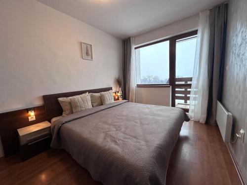 Ένα ή περισσότερα κρεβάτια σε δωμάτιο στο Host2U Belvedere Apartment - Ski in - out - FREE Parking