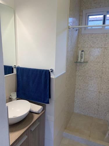 a bathroom with a sink and a shower at Complejo San roque in San Roque