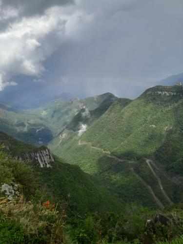 a view of a mountain valley with a dirt road at Casa do Camilo in Louro Müller