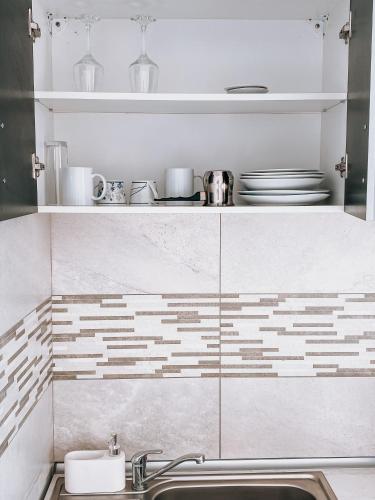a kitchen with a sink and a counter at Mountain View Apartment in Sibiu