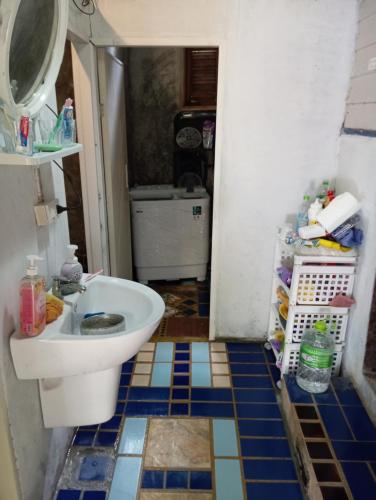 a bathroom with a toilet and a sink at Villa Somkid in Ban Hua Laem