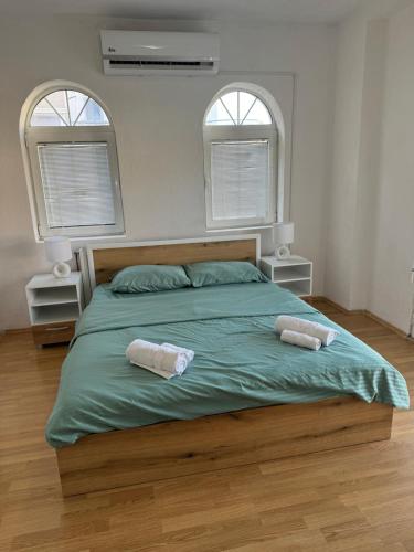 Ένα ή περισσότερα κρεβάτια σε δωμάτιο στο Angeloski Apartments