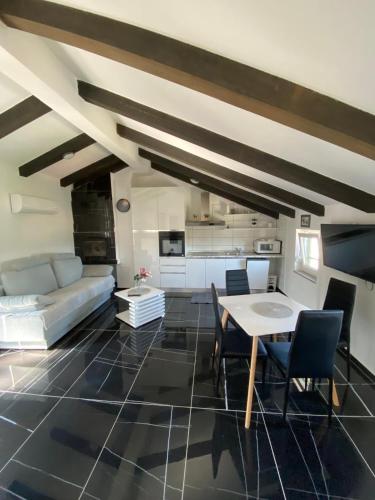 a living room with a couch and a table at House Melina in Vižinada
