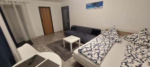 a living room with a couch and a table at FeWo2&Bad Wurzach in Bad Wurzach