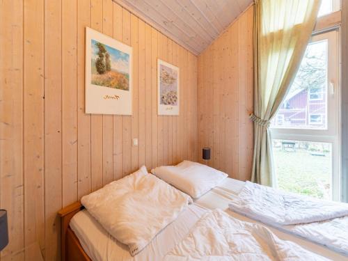 Ένα ή περισσότερα κρεβάτια σε δωμάτιο στο Ferienhaus ideal für Gruppen