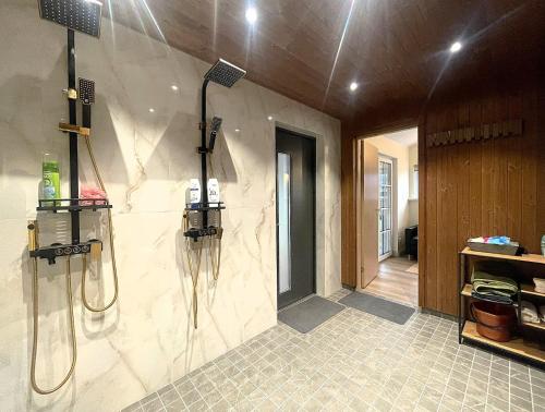a bathroom with a shower and a walk in shower at Olde Villa in Meegomäe